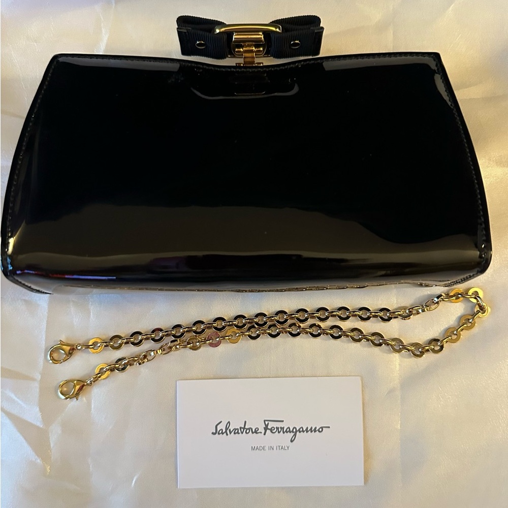 Salvatore Ferragamo black patent Vera Clutch Bag.